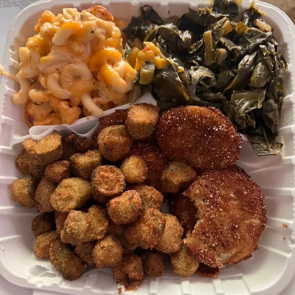 A Timeless Treat's soul food platter with mac and cheese, collard greens, fried okra, and fried green tomatoes.